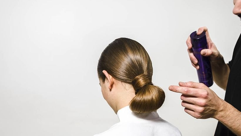 Hair styling with smoothing product and brush