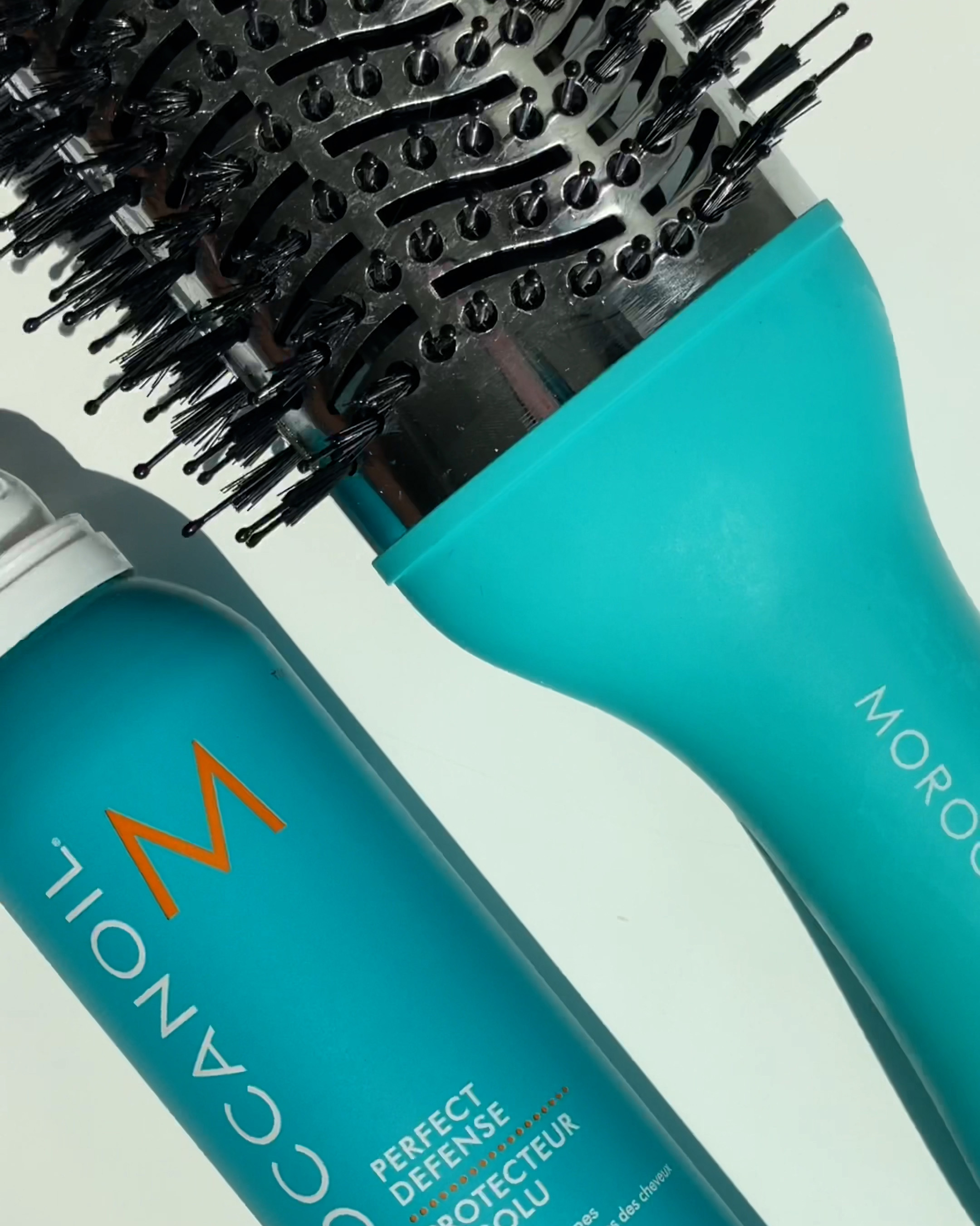 Hairbrush beside haircare products