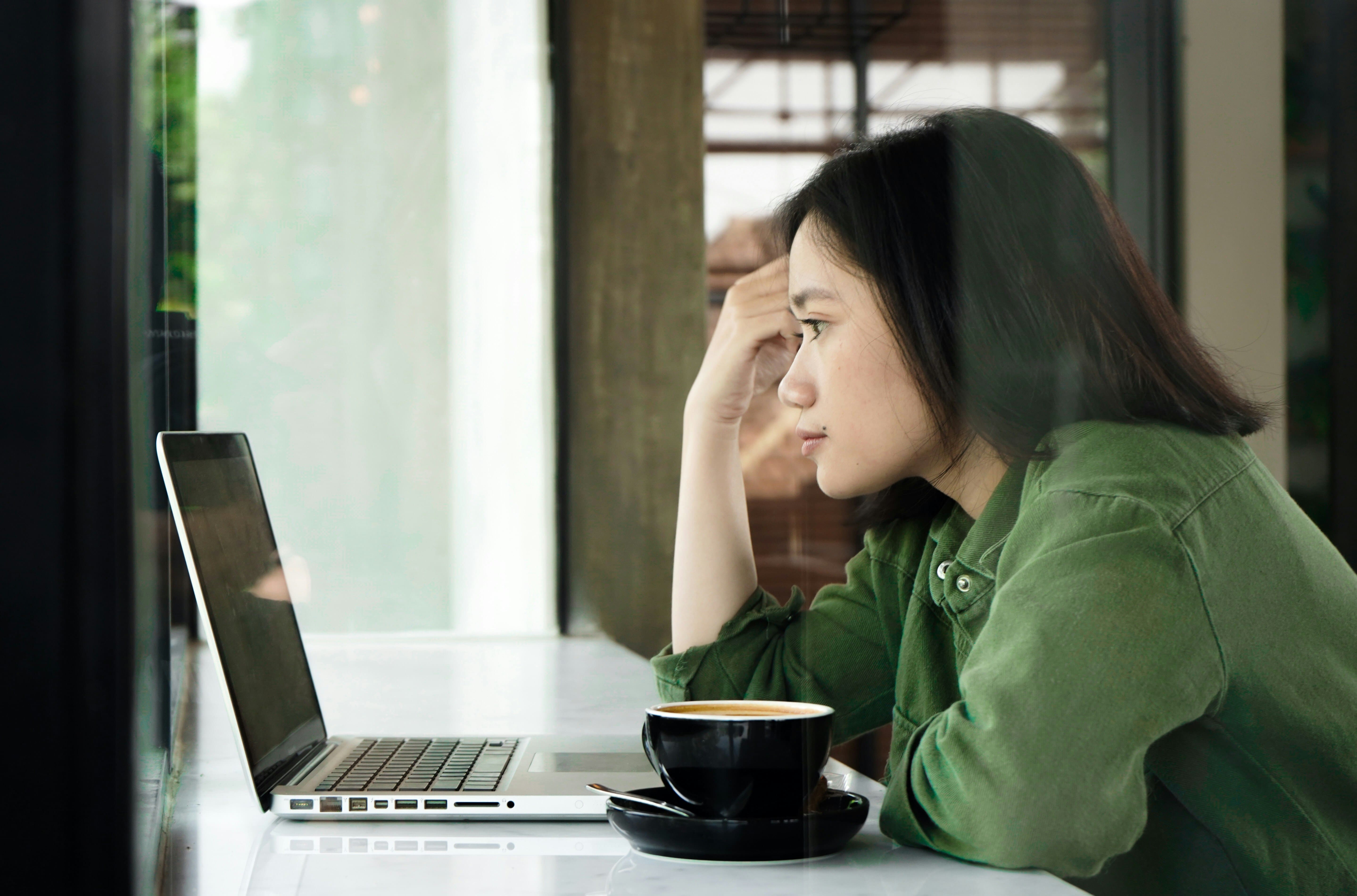 woman on a laptop - Benefits of Rehabilitation