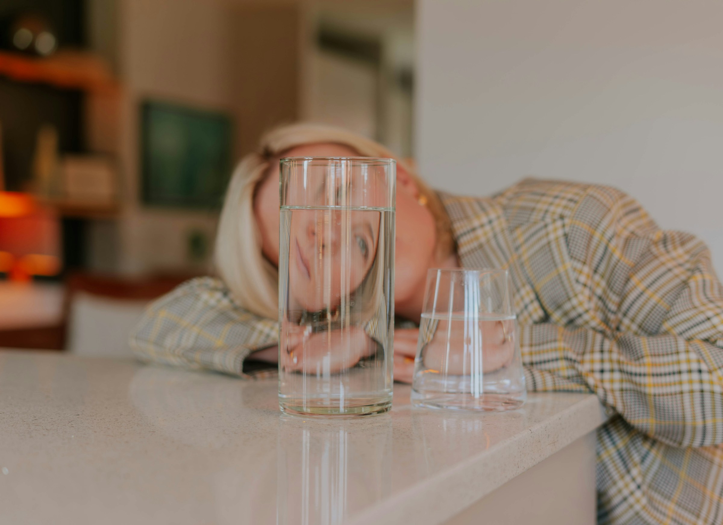 Woman with Glass of Water - Alcohol Withdrawal Headache